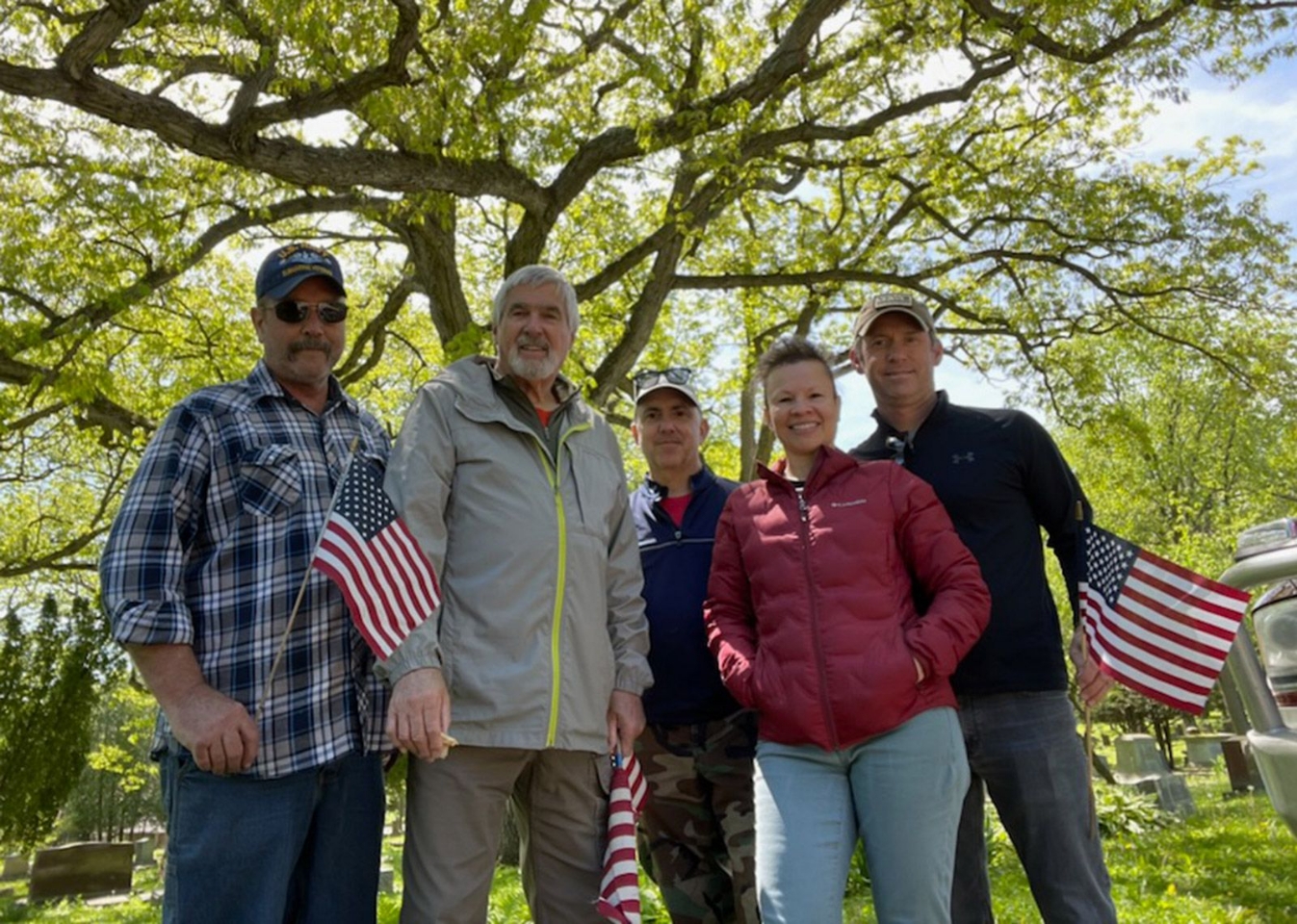 L to R: Steve Eisenhauer, Bill Austin, John Hahn, Elizabeth Harman, and Andy Lochner - places flags on the graves for Memorial Day
